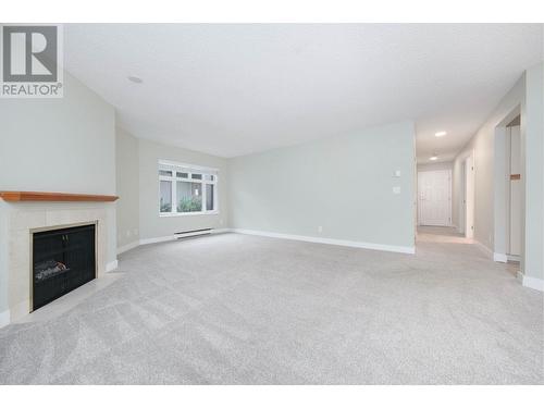 312 2800 Chesterfield Avenue, North Vancouver, BC - Indoor Photo Showing Living Room With Fireplace