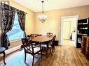 Dining area featuring hardwood / wood-style flooring and an inviting chandelier - 57 Lowell Street N, Cambridge, ON  - Indoor Photo Showing Dining Room 