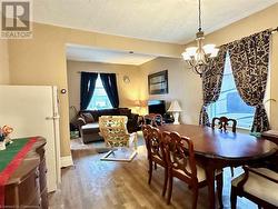 Dining room featuring a chandelier and wood-type flooring - 