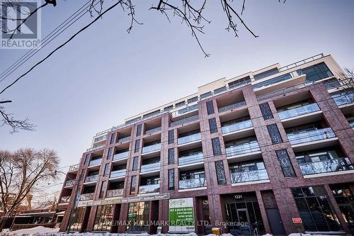 306 - 1331 Queen Street E, Toronto, ON - Outdoor With Balcony With Facade