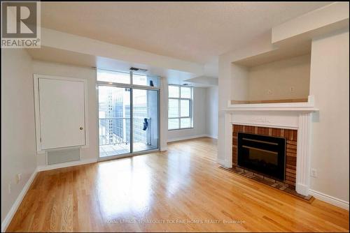 Lph6 - 105 Victoria Street, Toronto, ON - Indoor Photo Showing Living Room With Fireplace