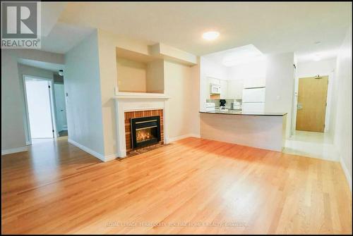 Lph6 - 105 Victoria Street, Toronto, ON - Indoor Photo Showing Living Room With Fireplace