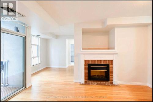 Lph6 - 105 Victoria Street, Toronto, ON - Indoor Photo Showing Living Room With Fireplace