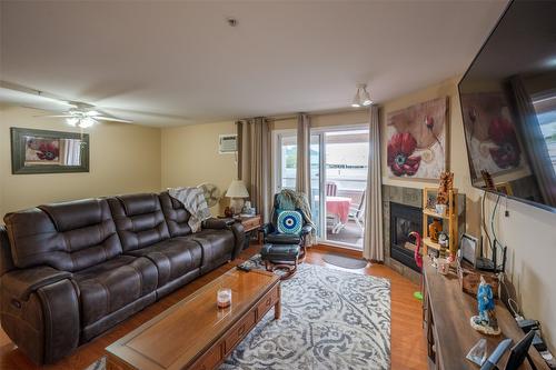 105-2401 South Main Street, Penticton, BC - Indoor Photo Showing Living Room With Fireplace