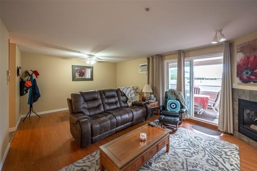 105-2401 South Main Street, Penticton, BC - Indoor Photo Showing Living Room With Fireplace