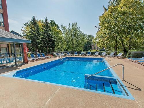 Pool - 301-4470 Ch. Des Cageux, Laval (Chomedey), QC - Outdoor With In Ground Pool With Backyard