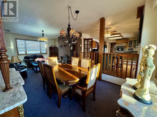 2017 89 Avenue, Dawson Creek, BC - Indoor Photo Showing Dining Room With Fireplace