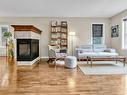 Living room - 1185 Rue Des Cavalières, Bromont, QC  - Indoor Photo Showing Living Room With Fireplace 