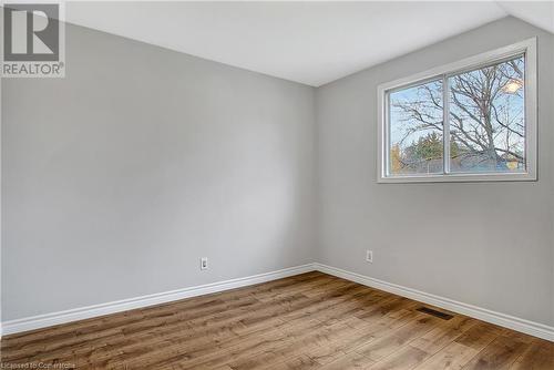 Spare room featuring light hardwood / wood-style floors and vaulted ceiling - 24 Crombie Street, Cambridge, ON - Indoor Photo Showing Other Room