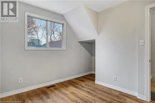 Bonus room featuring light wood-type flooring and lofted ceiling - 24 Crombie Street, Cambridge, ON - Indoor Photo Showing Other Room