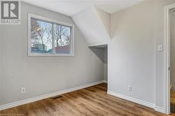 Bonus room featuring light wood-type flooring and lofted ceiling - 