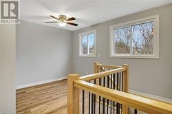 Hallway with light hardwood / wood-style floors - 