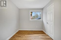 Unfurnished room featuring light wood-type flooring - 