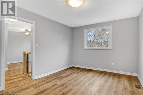 Unfurnished room with light hardwood / wood-style flooring and ceiling fan - 24 Crombie Street, Cambridge, ON - Indoor Photo Showing Other Room