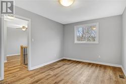 Unfurnished room with light hardwood / wood-style flooring and ceiling fan - 