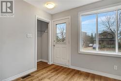 Doorway with light hardwood / wood-style flooring - 