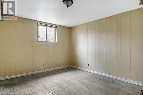 Spare room featuring wood walls - 24 Crombie Street, Cambridge, ON - Indoor Photo Showing Other Room