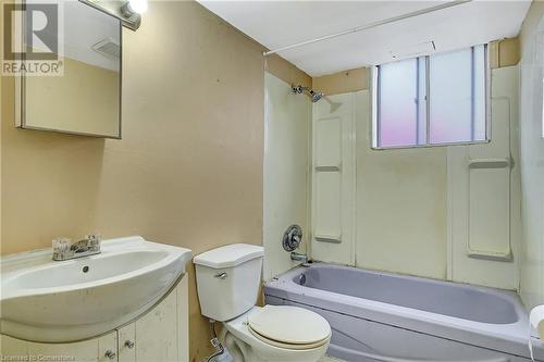 Full bathroom featuring shower / bathtub combination, toilet, and sink - 24 Crombie Street, Cambridge, ON - Indoor Photo Showing Bathroom