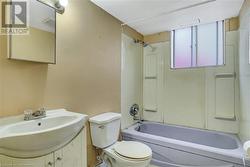 Full bathroom featuring shower / bathtub combination, toilet, and sink - 