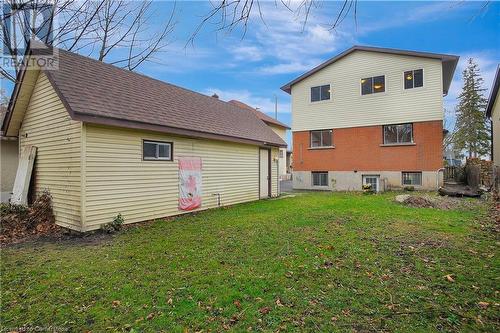 Rear view of house with a yard - 24 Crombie Street, Cambridge, ON - Outdoor With Exterior