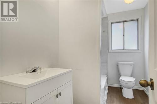 Bathroom with hardwood / wood-style floors, vanity, and toilet - 24 Crombie Street, Cambridge, ON - Indoor Photo Showing Bathroom