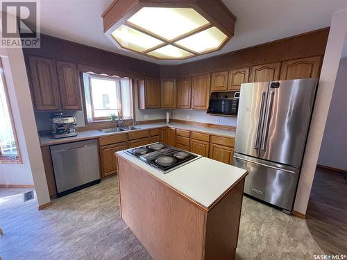 3023 Reves Road, Regina, SK - Indoor Photo Showing Kitchen With Double Sink