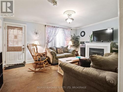 62 Douglas Street, Fort Erie (332 - Central), ON - Indoor Photo Showing Living Room With Fireplace