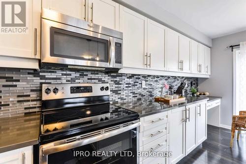 Upper - 1039 Diefenbaker Street, Milton, ON - Indoor Photo Showing Kitchen With Upgraded Kitchen