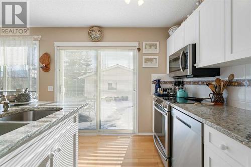 149 Tuscany Drive Nw, Calgary, AB - Indoor Photo Showing Kitchen With Double Sink With Upgraded Kitchen