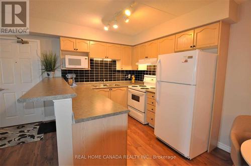 304 - 1490 Bishops Gate, Oakville, ON - Indoor Photo Showing Kitchen With Double Sink