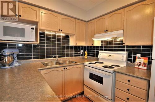 304 - 1490 Bishops Gate, Oakville, ON - Indoor Photo Showing Kitchen With Double Sink