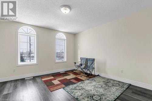 Sitting room with a textured ceiling and dark wood-type flooring - 529 Victoria Road N, Guelph, ON - Indoor Photo Showing Other Room