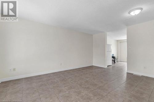 Spare room featuring light tile patterned floors and a textured ceiling - 529 Victoria Road N, Guelph, ON - Indoor Photo Showing Other Room