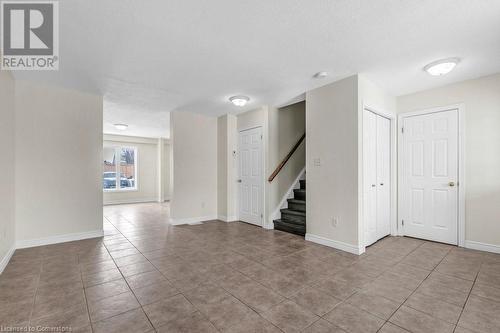 Empty room featuring light tile patterned floors and a textured ceiling - 529 Victoria Road N, Guelph, ON - Indoor Photo Showing Other Room