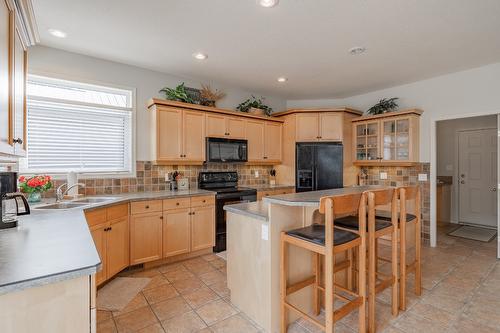 5214 Riverside Drive, Fairmont Hot Springs, BC - Indoor Photo Showing Kitchen With Double Sink