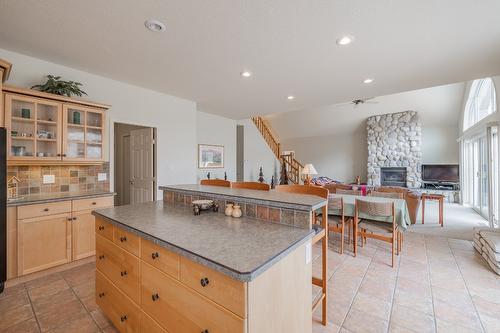 5214 Riverside Drive, Fairmont Hot Springs, BC - Indoor Photo Showing Kitchen With Fireplace