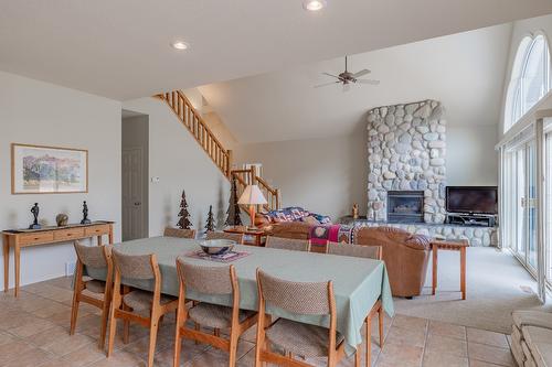 5214 Riverside Drive, Fairmont Hot Springs, BC - Indoor Photo Showing Dining Room With Fireplace