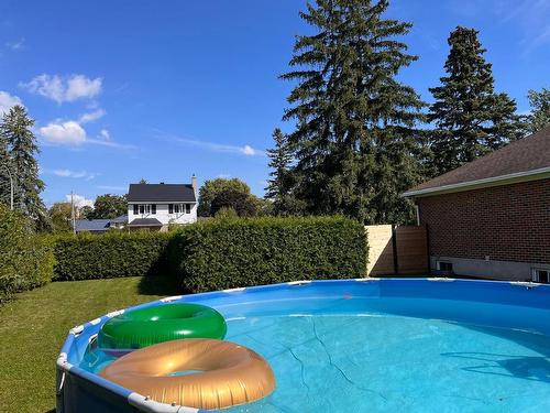 Cour - 70 Av. Charles, Pointe-Claire, QC - Outdoor With Above Ground Pool With Backyard