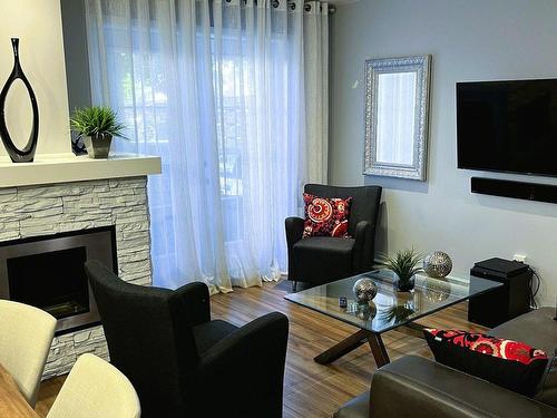 Salon - 238 Rue Joseph-Bresse, Chambly, QC - Indoor Photo Showing Living Room With Fireplace