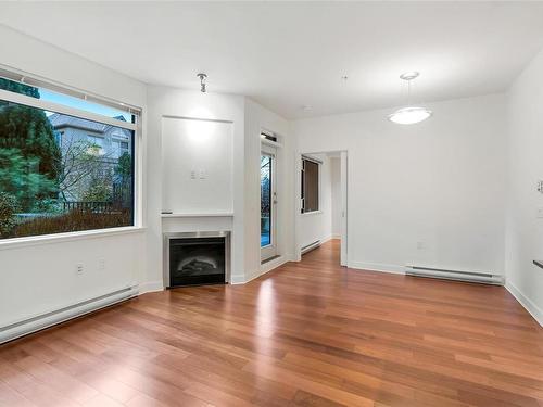 103-3614 Richmond Rd, Saanich, BC - Indoor Photo Showing Living Room With Fireplace