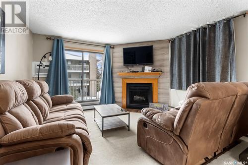 201B 55 Wood Lily Drive, Moose Jaw, SK - Indoor Photo Showing Living Room With Fireplace