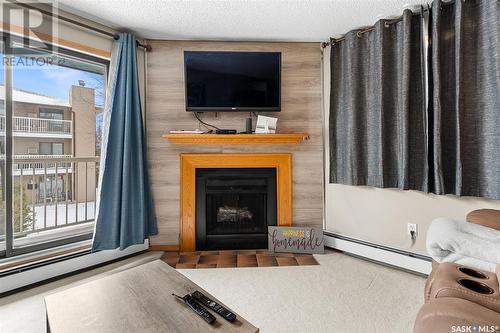 201B 55 Wood Lily Drive, Moose Jaw, SK - Indoor Photo Showing Living Room With Fireplace