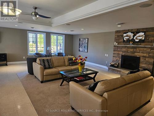 504 - 200 East Street S, Kawartha Lakes, ON - Indoor Photo Showing Living Room With Fireplace