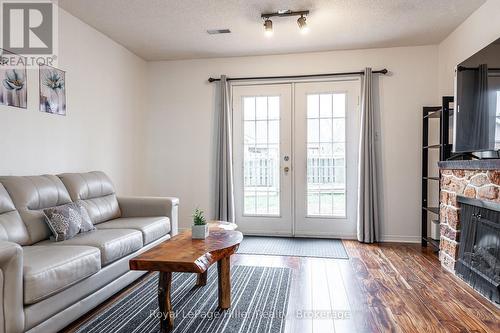 80 Burnham Court, Stratford, ON - Indoor Photo Showing Living Room With Fireplace