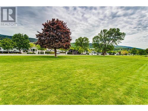 View from Swan Lake toward the homes in your community. Many park models in the community with RV’s and some rental RV sites available - 8000 Highland Road Unit# 153, Vernon, BC 