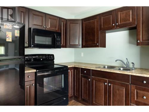 Well maintained cupboards. - 68 Specht Road, Cherryville, BC 