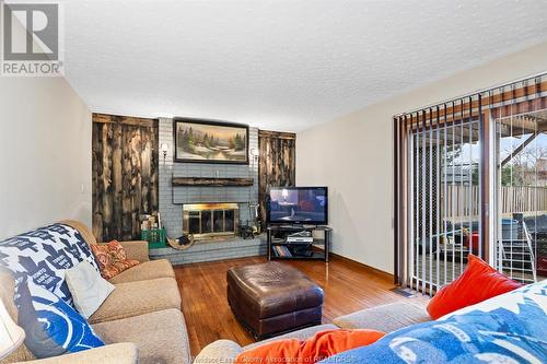 213 Wedgewood, Tecumseh, ON - Indoor Photo Showing Living Room With Fireplace