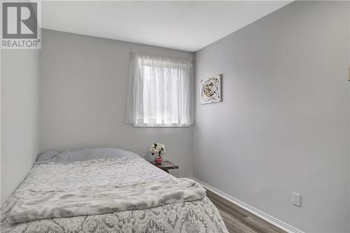 Bedroom featuring dark wood-type flooring - 220 Salisbury Avenue Unit# 6, Cambridge, ON - Indoor Photo Showing Bedroom