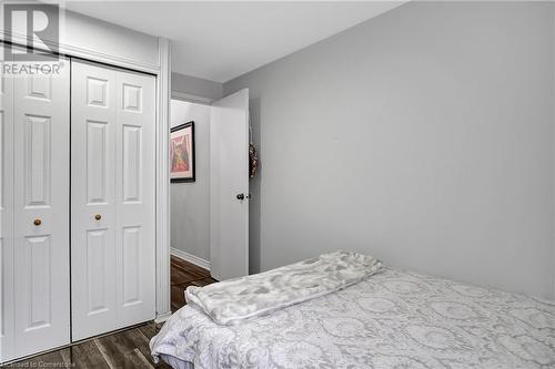 Bedroom featuring dark wood-type flooring and a closet - 220 Salisbury Avenue Unit# 6, Cambridge, ON - Indoor Photo Showing Bedroom