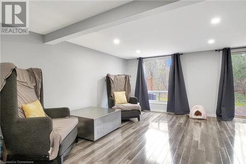 Living area featuring plenty of natural light, beamed ceiling, and hardwood / wood-style floors - 220 Salisbury Avenue Unit# 6, Cambridge, ON - Indoor